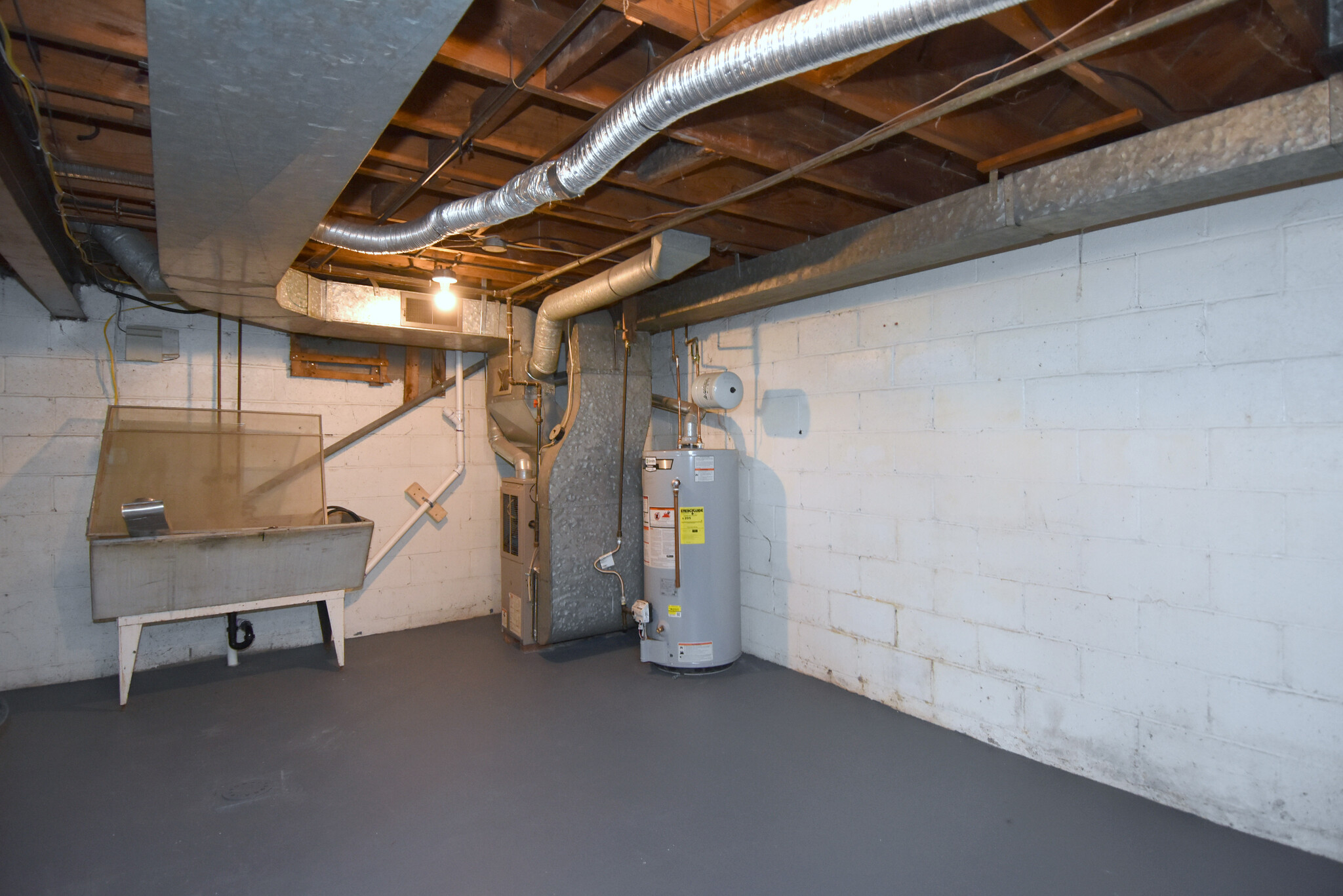 Spacious basement with newly painted floor and tons of storage space. - 31 Marylea Ave