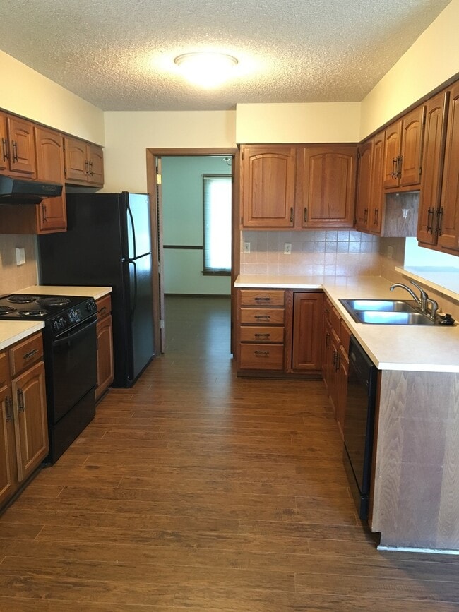 Building Photo - 7511 E 24th Ct N