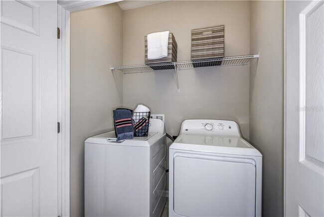 Side by side washer and dryer with Newer Appliance included. It has a Shelf for Storage. Save Money - 1074 Amber Leaf Trail