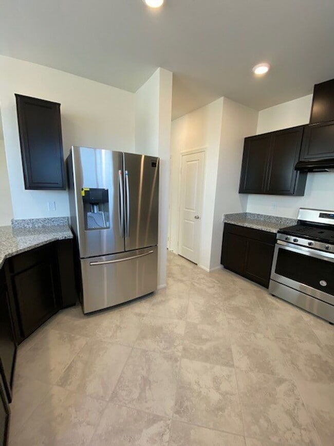 Building Photo - Beautiful Townhome in a Gated Community with 2-Car Garage!!