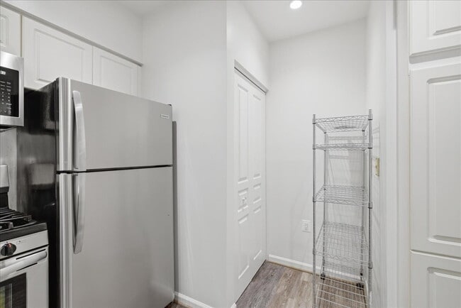 Building Photo - Commuter’s Paradise! Ground-Level 2BR Condo  Welcome home to this stunning, sun-filled 2-bedroom ...