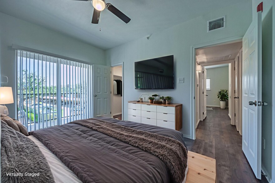 virtually staged photo of main bedroom - 11234 Park Central Pl