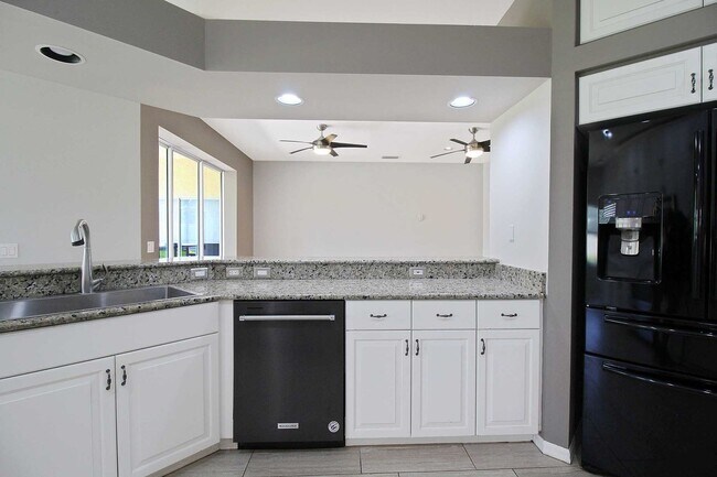 Building Photo - Annual rental: Spacious 3BR/2BA Creekwood Home with Office, Screened Lanai, EV Charger & Resort-S...