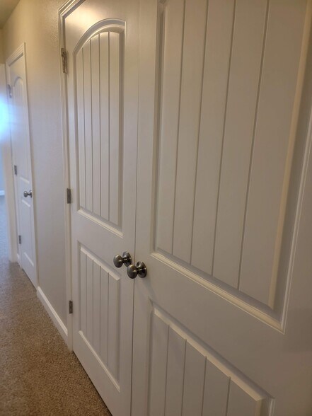 Laundry doors in main hallway - 218 N Washington St