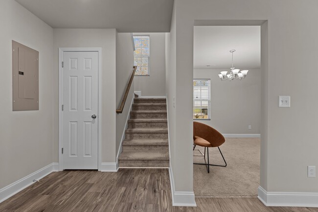 View of stairs and entryway from kitchen - 105 E Carolina Ave