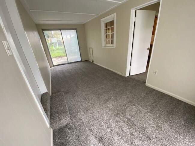 Building Photo - Charming West Akron Ranch with Walk-Through Sunroom