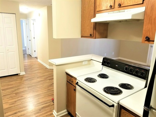 kitchen with stove/dishwasher/fridge - Dellwood Apartments