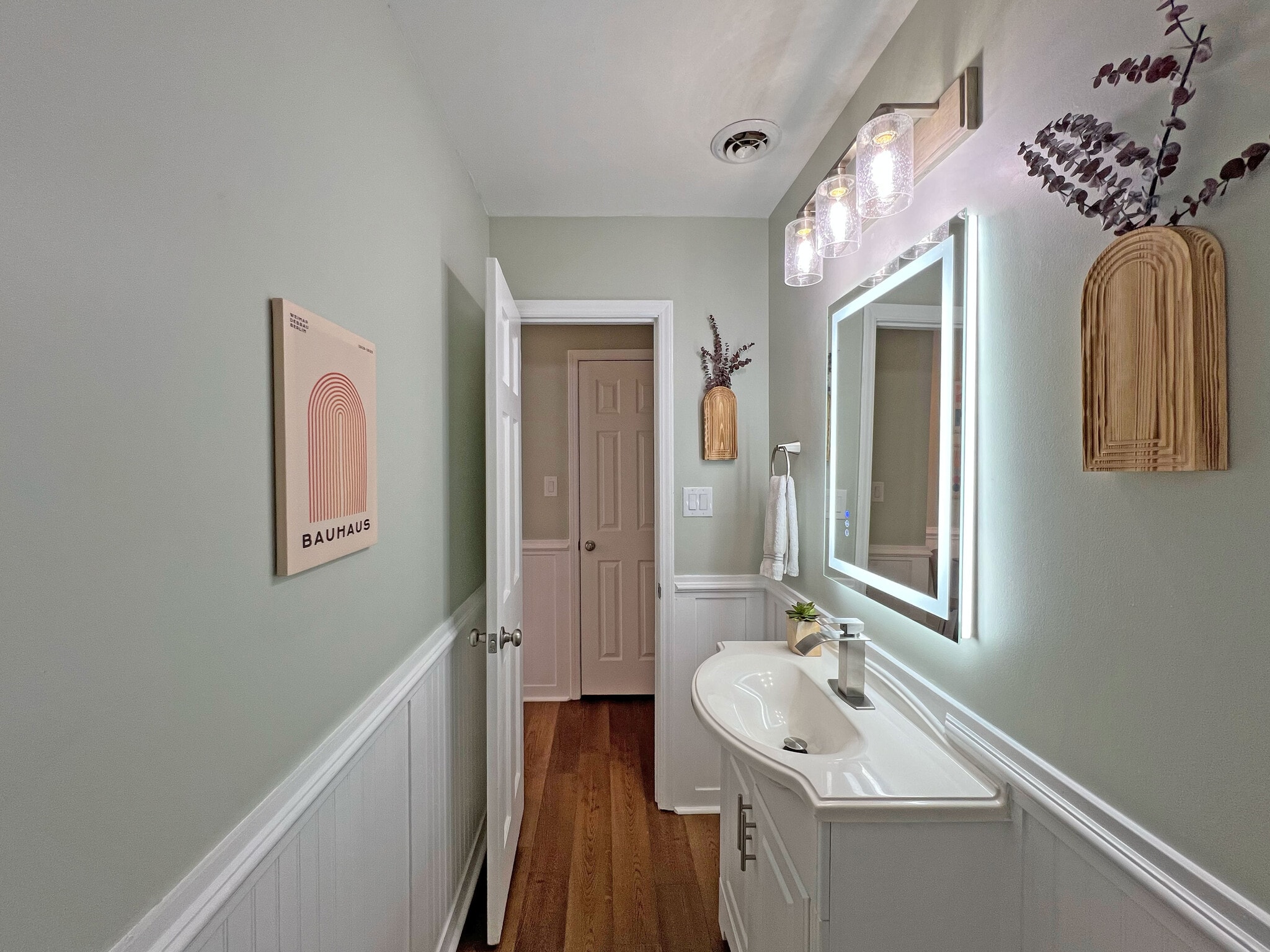 Large half bathroom featuring powered LED mirror - 160 17th Street Pl NW