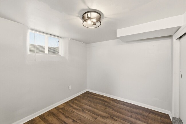 Building Photo - Renovated studio with garage + utilities included! Modern kitchen with island, updated bath, on-s...