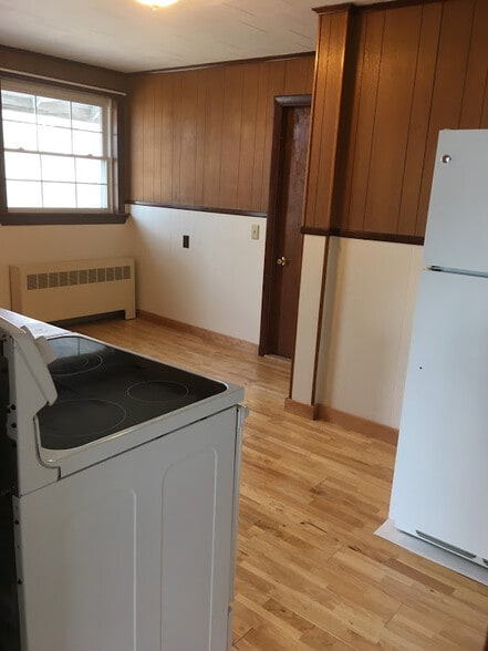 View of Kitchen and back entrance from 16 O'Brien's private parking area. - 16 Obrien Ave