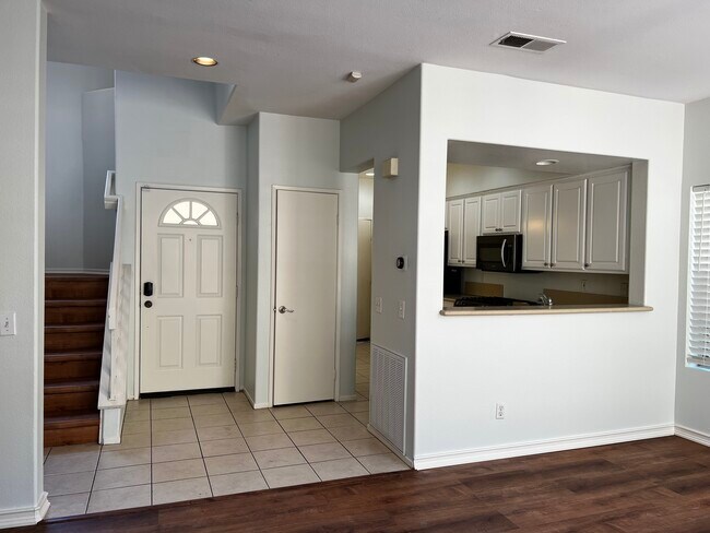 Kitchen to staircase view - 10924 Creekbridge Plz