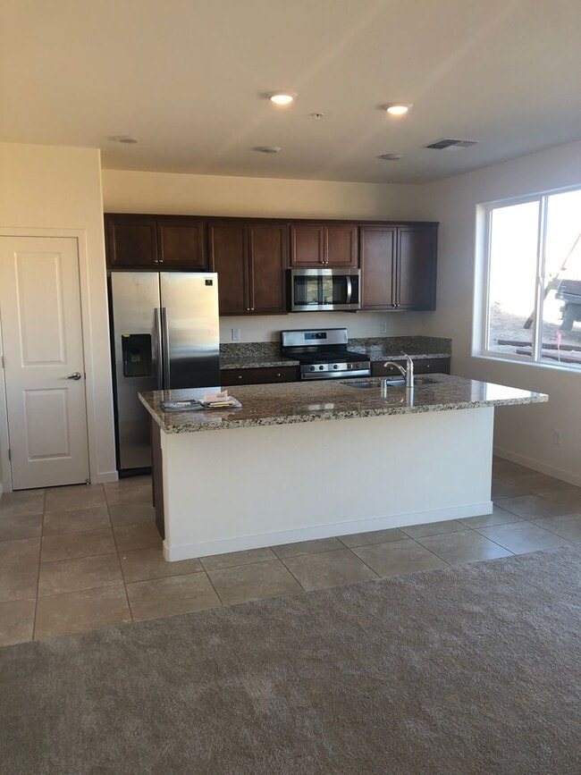 Building Photo - CORNER LOT - END UNIT - NO YARD TO MAINTAIN - GRANITE - STAINLESS - GATED