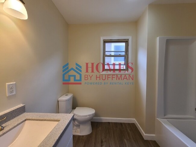 Building Photo - Downstairs | Three Bedroom Duplex