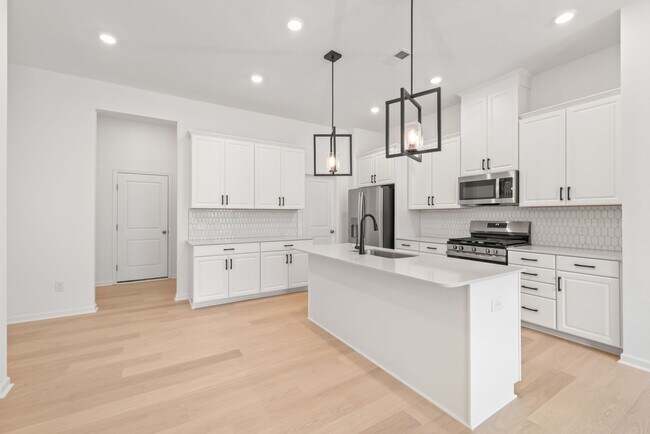 Building Photo - Welcome home to this stunning brand-new townhome in one of Indian Trail's newest and most desirab...