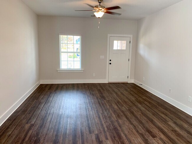 Building Photo - Spacious home with Garage and Fenced Backy...
