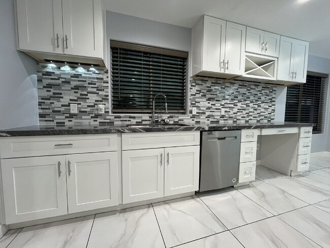 Building Photo - "Charming 4-Bed Oasis with Granite Touch & a Beautiful Pool"