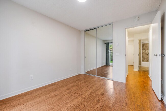 Building Photo - Sweet & Cozy 2/1 condo available in Mt. Park with covered parking, in-unit laundry, outdoor pool ...