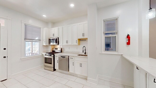 Building Photo - Four Bedroom 2,500 Square Foot House W/Back Patio, Multiple Kitchens/Laundry Facilities