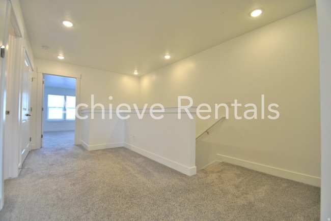 Building Photo - Woodmore Pointe HOA | Modern Logan Townhome in Prime Location