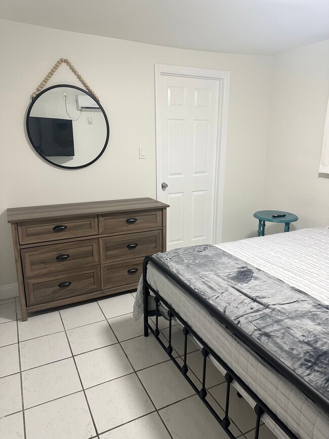 Large bedroom with Queen bed and wall to wall closet. - 6859 SW 42nd Terrace