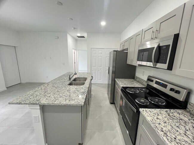 Building Photo - BRAND NEW ONE BEDROOM, ONE BATH-ONE CAR GARAGE- LEHIGH ACRES