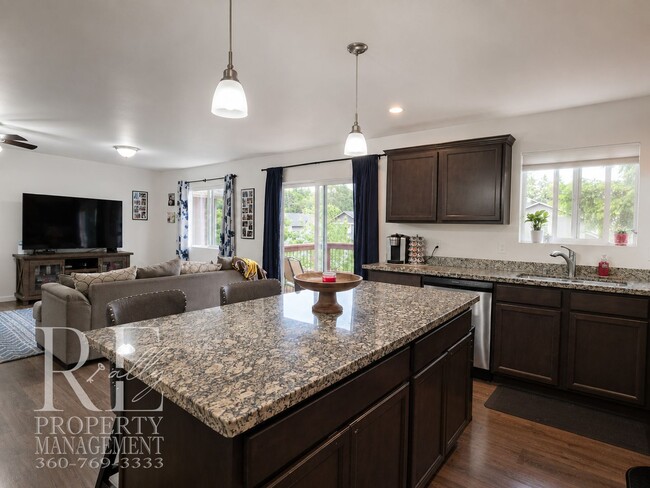 Building Photo - Spacious 3-Story Home with Flexible Living Space, Heat Pump & Private Deck Retreat