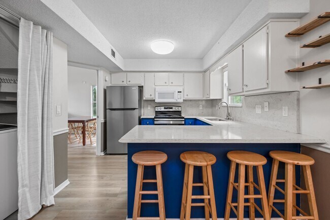 Building Photo - Spacious 3BR Retreat with Soaring Ceilings & Screened Porch