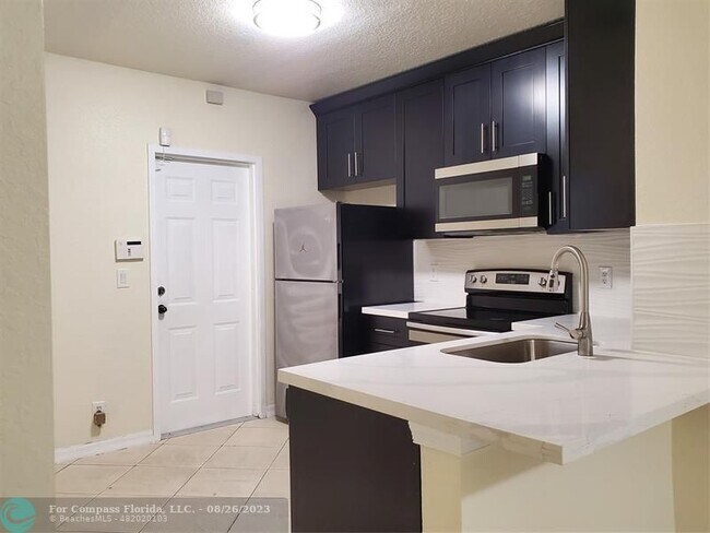 Building Photo - 7661 Tamarac Island Cir