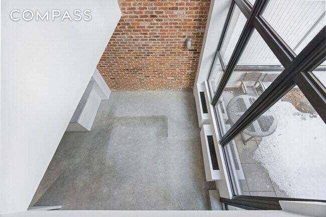 Building Photo - Loft-style one-bedroom with double-height ceilings, oversized windows, and private garden in the ...