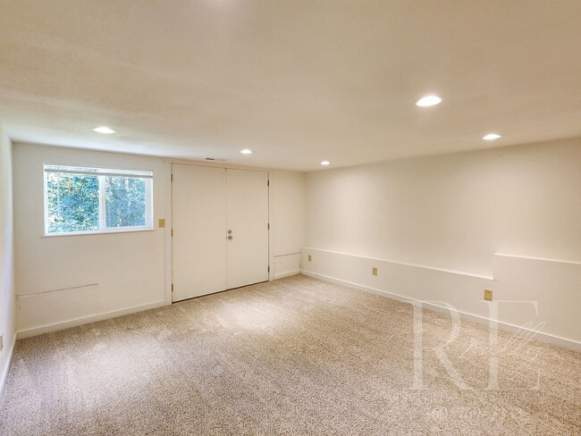 Building Photo - Vaulted Ceilings, Unique Designer Kitchen & Expansive Half-Acre Setting with Flexible Living Spaces