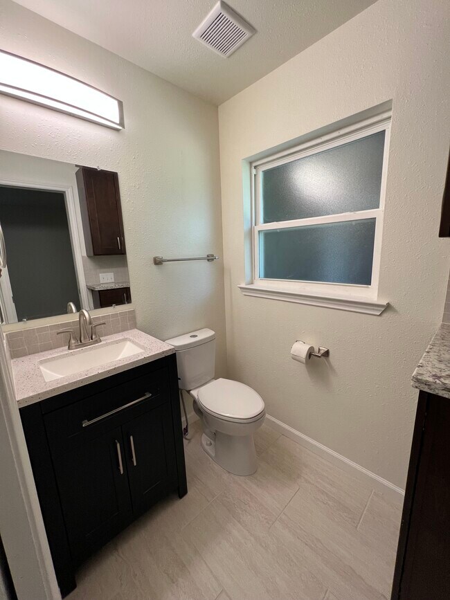 Second half bath with access to master bedroom. - 6015 Heffernan St