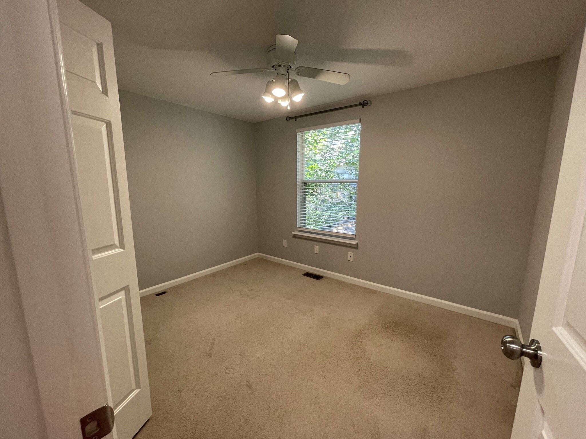 Second bedroom with ceiling fan, room darkening blinds, and curtain rod - 4204 Whistler Ct