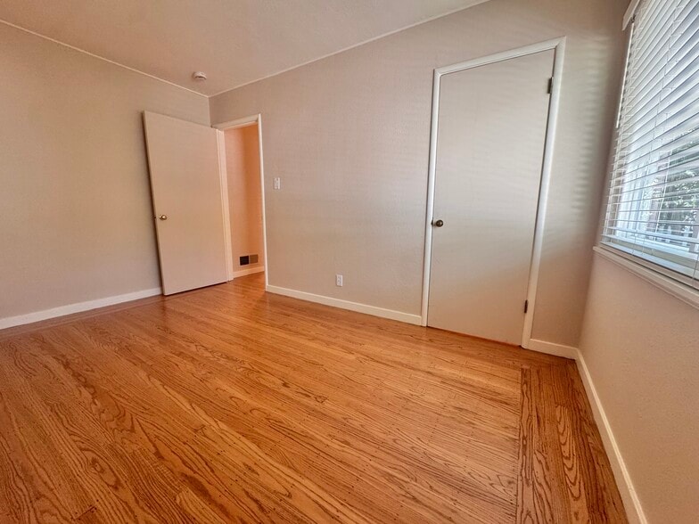 The third bedroom is the most private, quietly anchoring the northeast corner of the house. Both bed - 2403 Mira Vista Dr