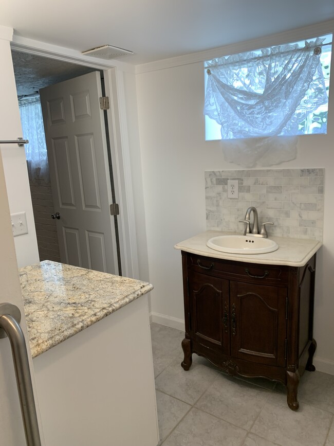 bathroom with vanity mirror on opposite side of sink - 1603 S High St