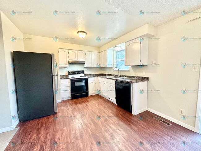 Building Photo - $1000.00 Off Move-In Costs! Charming 3-Bed...