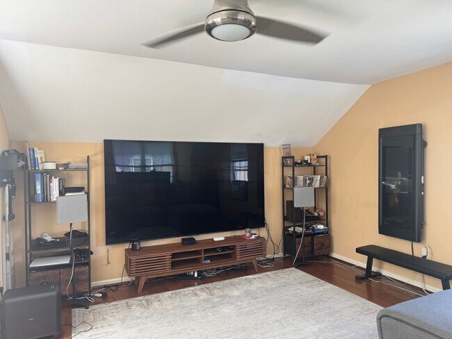 Building Photo - Stunning 3–4 Bedroom Townhome in Private Community | Garage + EV Charger | Deck with Tree Views