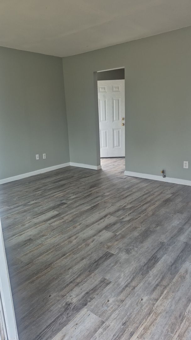 Building Photo - Freshly Brick Home with Flooring & Clean Neutral Finish