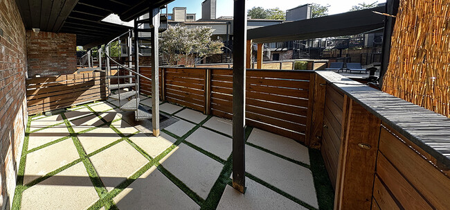 A circular staircase from balcony leads to this patio with pool access - 8710 Park Ln