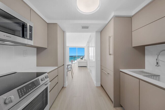 Building Photo - 6365 Collins Ave