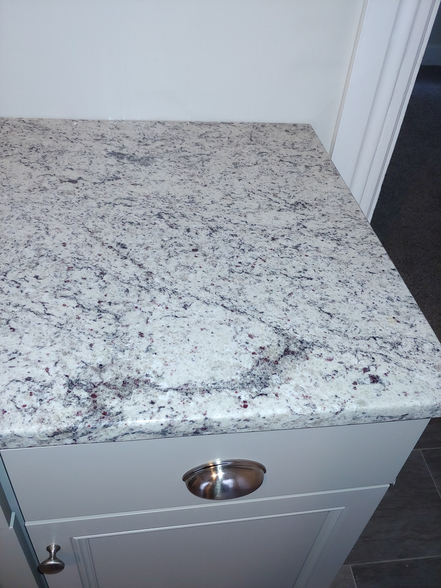 Dallas White granite. Nickel hardware - 57 Cartier St