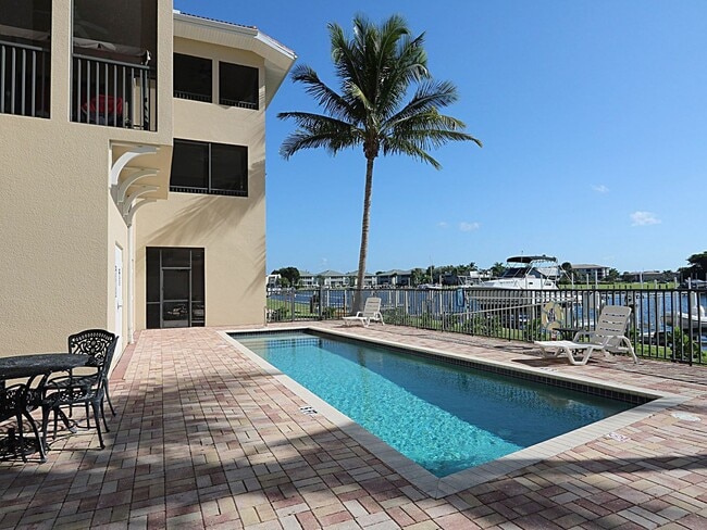 Building Photo - BEAUTIFUL 3-BEDROOM  WATERFRONT CONDO WITH BOAT SLIP AND HEATED POOL