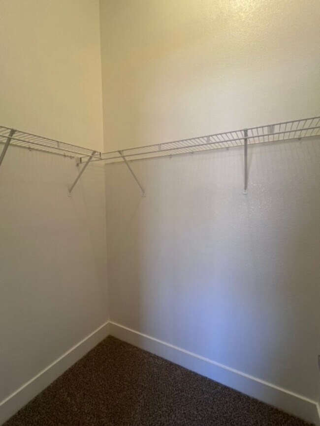 Building Photo - Three bedroom townhouse with 2 car garage