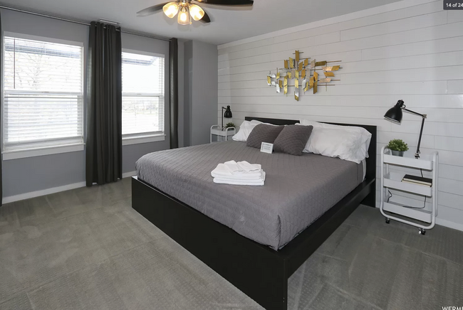 Master bedroom (pictured) has sizable space and large closet, with views of the treelined street - 584 N 8th W