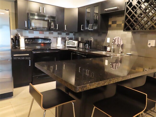 Building Photo - 5701 Collins Ave