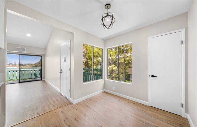 Breakfast area, front door, living room & balcony - 20415 S Vermont Ave