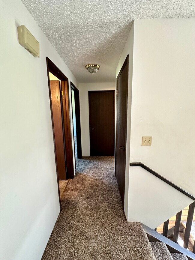 Upstairs hallway leaving living room - 13409 E 8th Ave