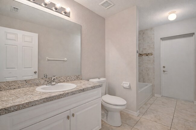 Building Photo - Spacious Three-Bedroom Home with Open Floor Plan, Large Yard & Screened Patio