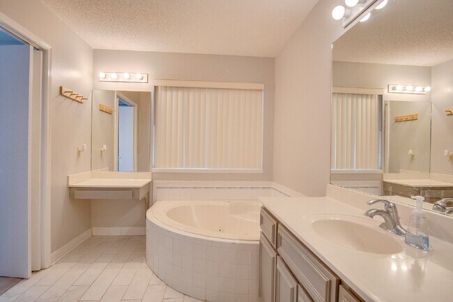 Building Photo - Pool Home with Office, Two Primary Suites ...