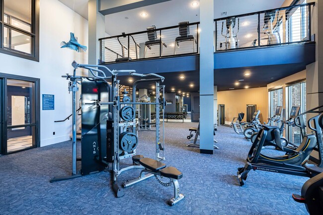 Two-Story Fitness Center with Cardio, Resistance & Free Weights - Botanic Luxury Living