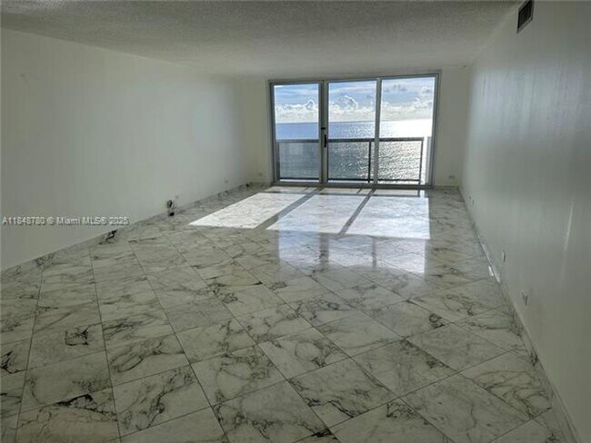 Building Photo - 6039 Collins Ave